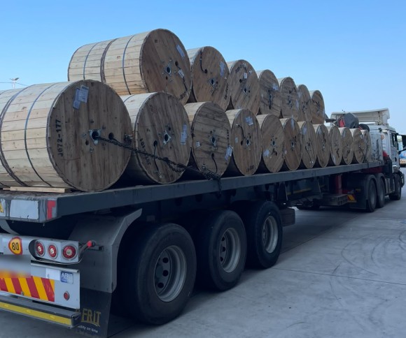 Inventta truck and trailer loaded with cable drums